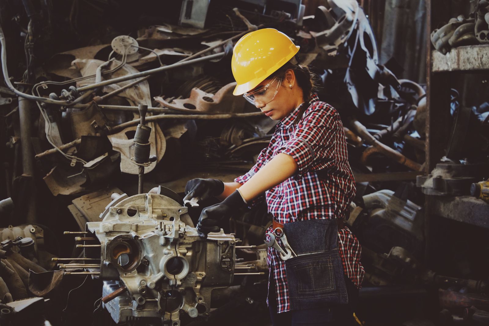 Technician assembling a component on a shop floor